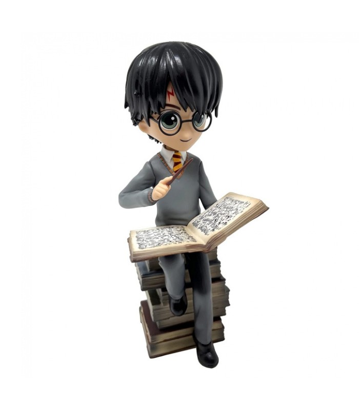 Figurine Harry Potter sur une pile de Grimoires - Boutique Harry